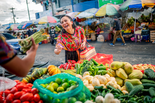 Beautiful Latina shopper enjoys shopping at the vegetable market.