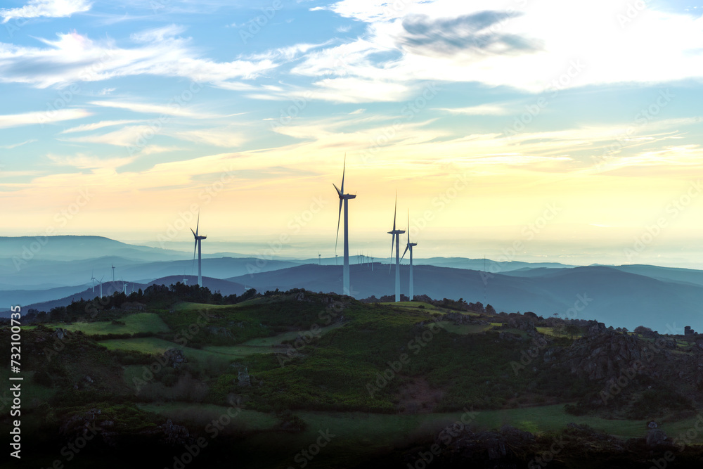 Landscape with renewable and sustainable energy with wind turbines on mountain, Portugal