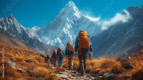 Group of People Hiking up a Mountain photo