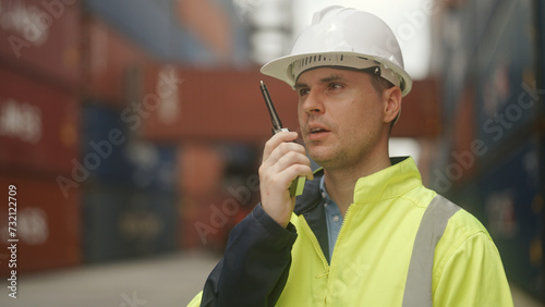 port operator uses a walkie-talkie.