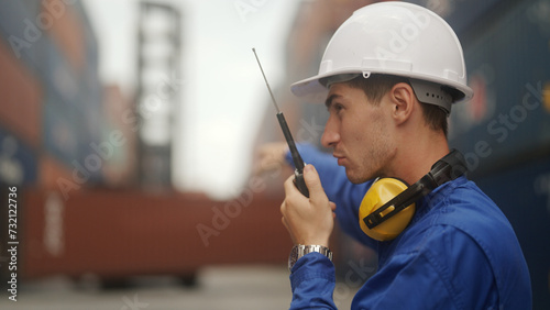 port operator uses a walkie-talkie.