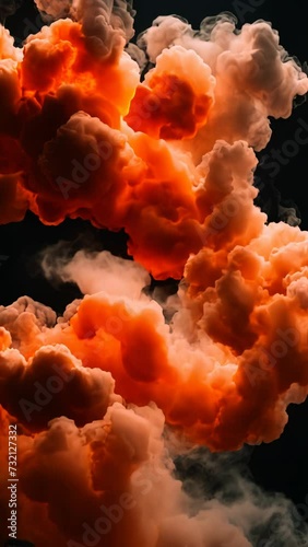 orange colored smoke on a black background 4K vertical video	