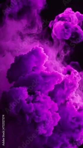 purple colored smoke on a black background 4K vertical video	