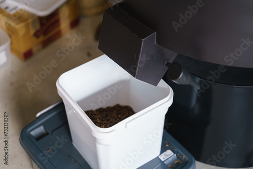 Packing roasted coffee beans from roasting machine