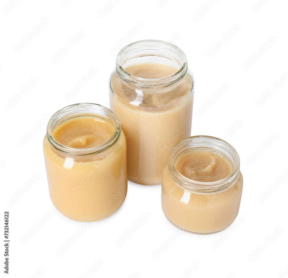 Baby food. Tasty healthy puree in jars isolated on white Baby food. Tasty healthy puree in jars isolated on white