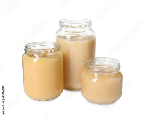 Baby food. Tasty healthy puree in jars isolated on white