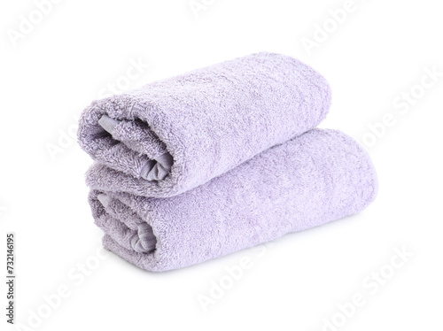 Rolled violet terry towels isolated on white