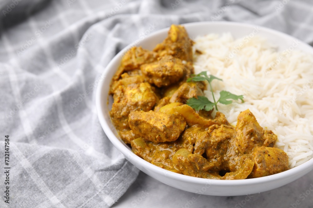 Delicious chicken curry with rice on table, closeup Delicious chicken curry with rice on table, closeup