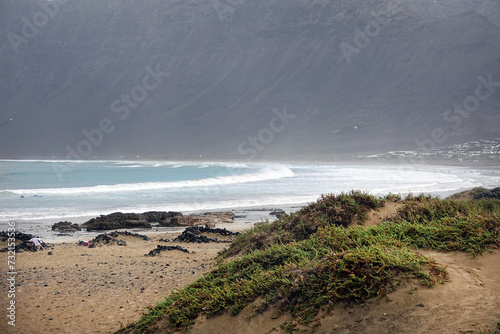 Landscape of the wild surf beach Famara in the north west of Lanzarote photo