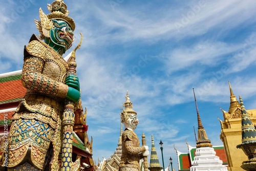 Thotsakan and Sahatsadecha, the two giant statues - characters from the Ramakien epic - guarding the rear Koei Sadet Gate of the Wat Phra Kaew or Temple of the Emerald Buddha in Bangkok, Thailand photo