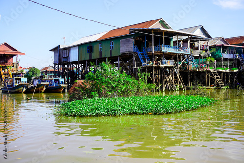 Siem Reap, Cambodia -December 11, 2023 : boat trip on the  River in Cambodia. Fishing villages and houses on the water © Liubov