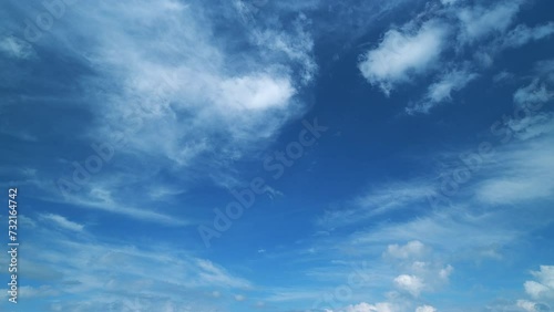 Tropical summer sunlight. Blue sky with cirrus clouds. Fluffy layered cirrus clouds sky atmosphere. photo