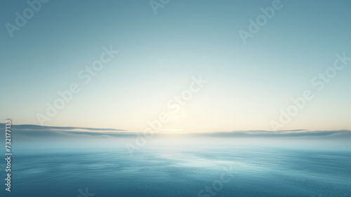 Misty Sunrise over a Calm Ocean