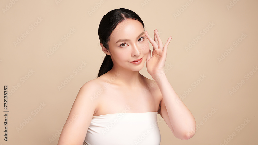 Beautiful young asian woman with clean fresh skin on beige background, Face care, Facial treatment, Cosmetology, beauty and spa, Asian women portrait. Beautiful young asian woman with clean fresh skin on beige background, Face care, Facial treatment, Cosmetology, beauty and spa, Asian women portrait.