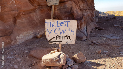 A rustic old sign post for the best view in Petra with an arrow in the popular tourism destination of the ancient city of Petra in Jordan, Middle East