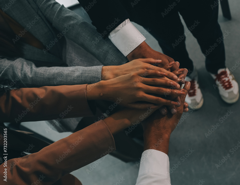 Obraz premium Group of college touch hands for unity group to success business.