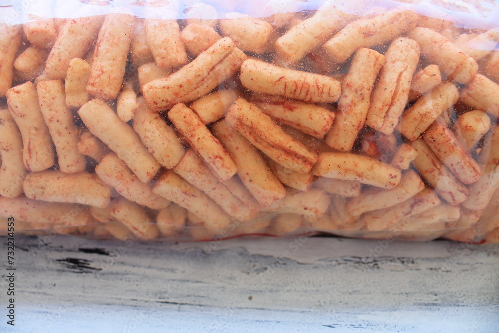 Indonesian snack called spicy crackers in plastic on the table Indonesian snack called spicy crackers in plastic on the table