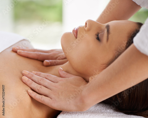 Woman  relax and body massage in spa for rest  wellness and peace with sleeping of healing hands. Person  comfort and masseuse for health treatment with zen  calm and detox on bed in holiday resort