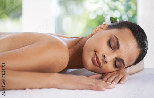 Relax  peace and woman at spa for skincare  massage and calm at table to rest for zen at luxury resort. Beauty  therapy and young person at salon for healthy body  treatment and pamper for wellness