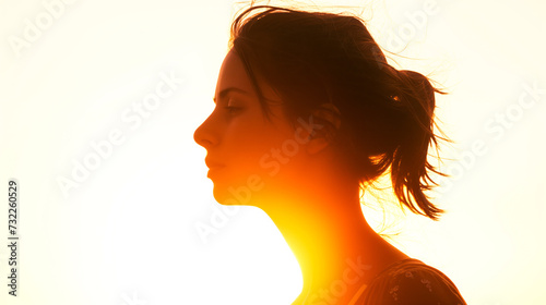 A woman during the golden hour, showcasing the soft natural lighting