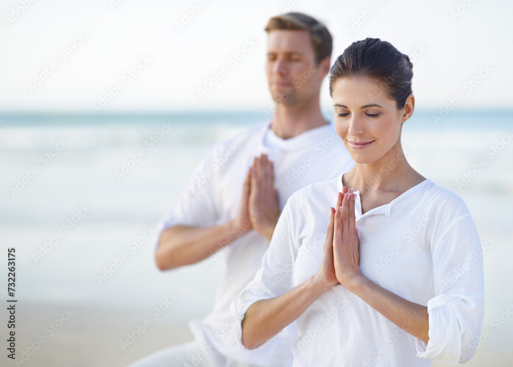 Naklejka premium Couple, yoga and ocean with meditation, peace and sitting on sand in morning with mindfulness in summer. Man, woman and outdoor for namaste with spiritual growth, balance or zen at beach in Cape Town