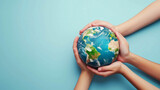 Guardianship of Earth - Hands Embracing the Planet, Human hands tenderly encase a small globe against a turquoise backdrop, evoking the concept of guardianship over our planet.