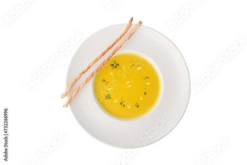 Pumpkin cream soup in bowl isolated on white background