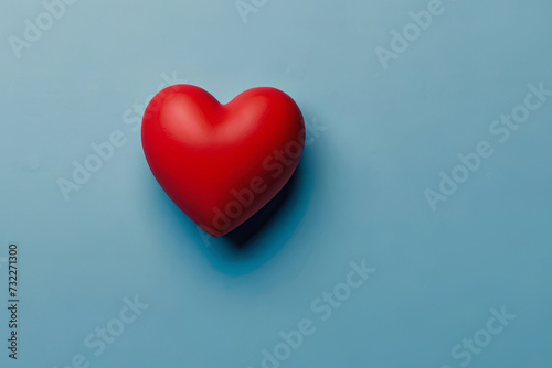 Heartfelt Valentine's Day. Red heart on blue background with copy space. Perfect for romantic messages. 