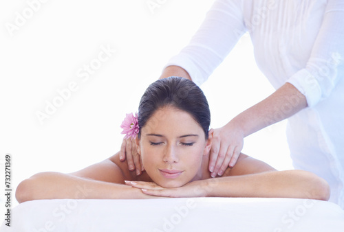 Sleep  massage and woman at spa with flower for health  wellness and luxury holistic treatment. Self care  peace and girl on table with masseuse for body  balance and relax with hotel service