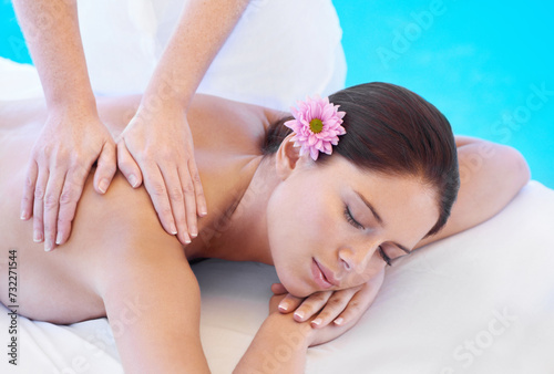 Relax, massage and woman at spa for health, wellness and calm with holistic treatment. Self care, peace and girl on table with masseuse for body therapy, shoulder muscle and luxury hotel service.