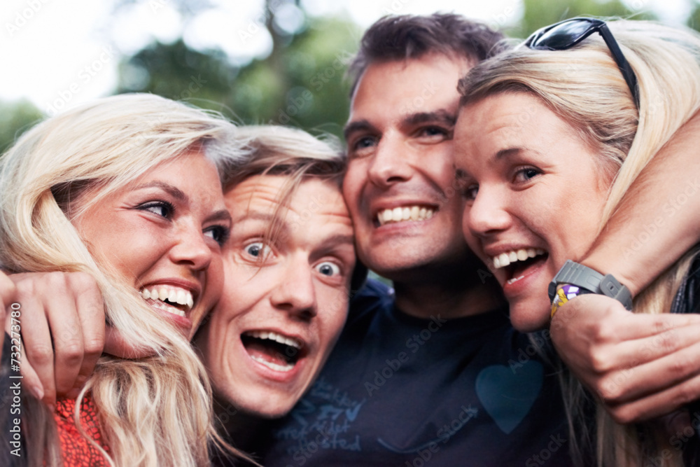 Face, smile and hug with excited friends closeup outdoor in nature together for travel, festival or adventure. Party, energy or wow with man and woman group laughing in forest or woods in summer - obrazy, fototapety, plakaty 