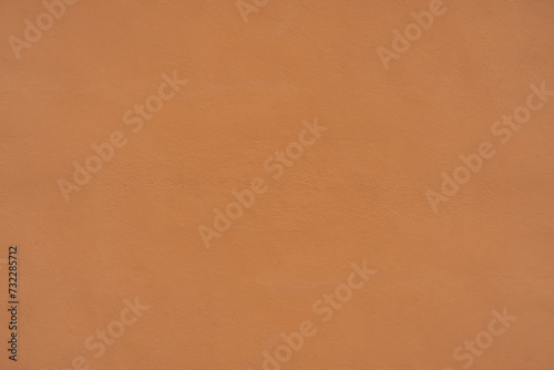 orange plaster wall of old mediterranean city