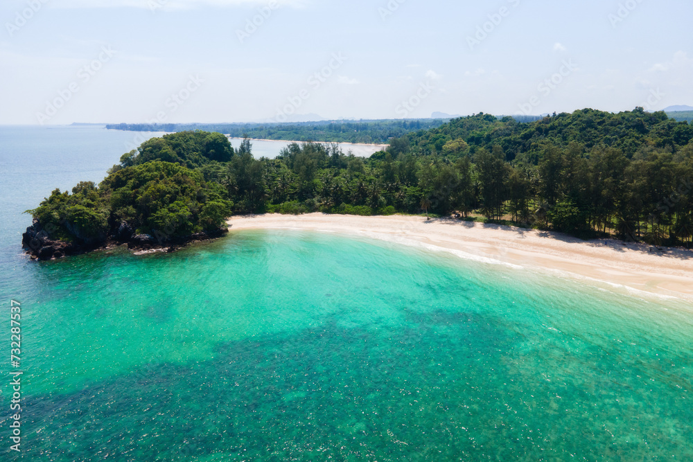 Island in Thailand with blue water, white sandy beach