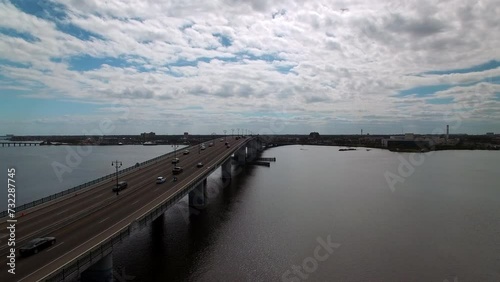 Wallpaper Mural Aerial Shot Of Cars Moving On Segmental Bridge In City, Drone Flying Backwards Over River On Sunny Day - Daytona Beach , Florida Torontodigital.ca