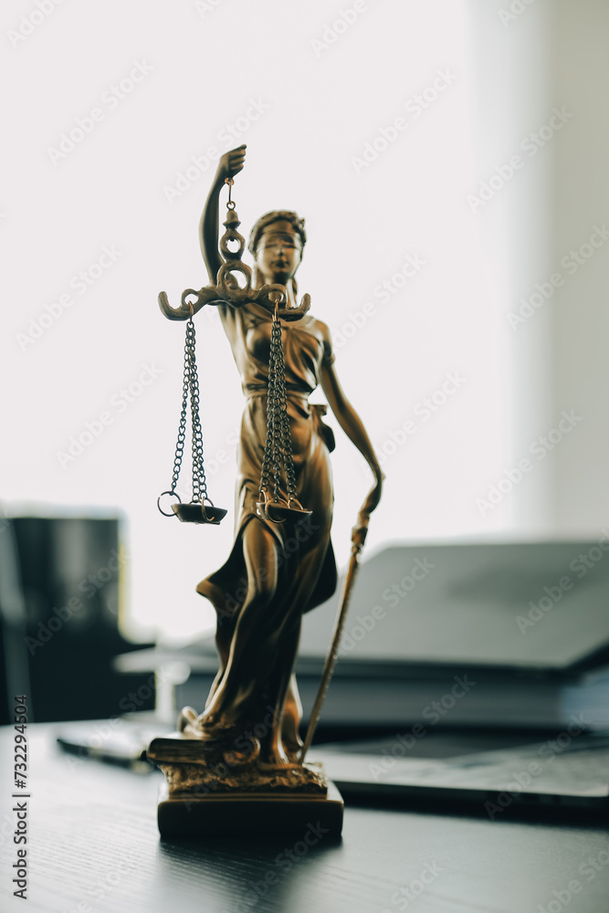 Judge gavel with Justice lawyers having team meeting at law firm background. Concepts of Law and Legal services. Judge gavel with Justice lawyers having team meeting at law firm background. Concepts of Law and Legal services.