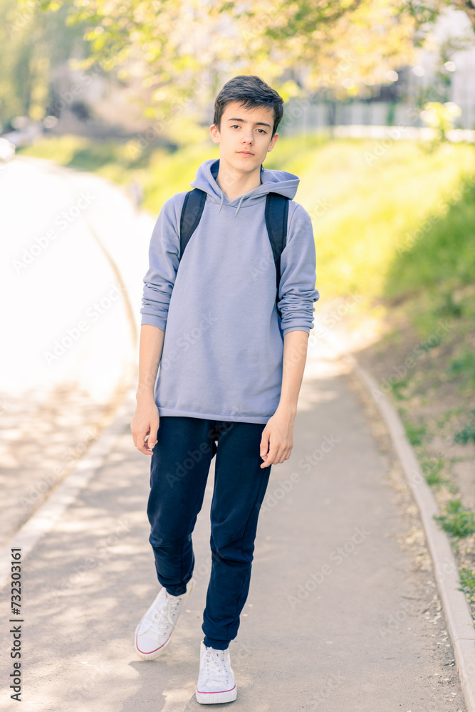 Portrait of adolescent in casual clothes on the street