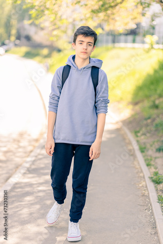Portrait of adolescent in casual clothes on the street © Cavan