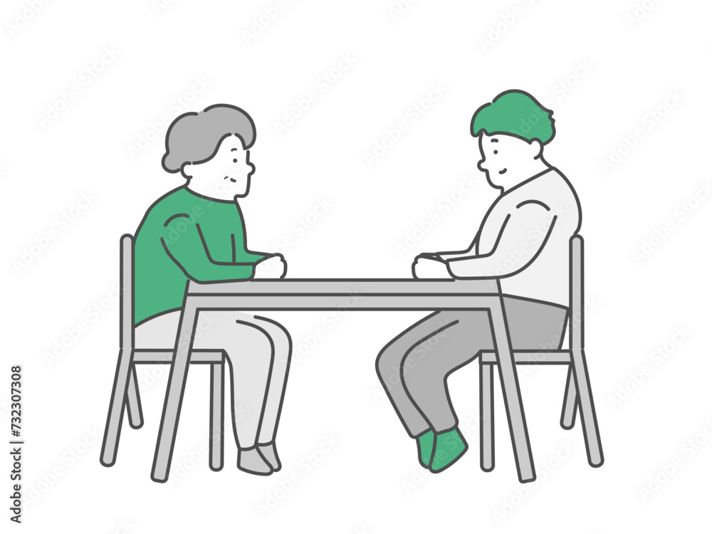 話し合いをする高齢女性と男性介護士