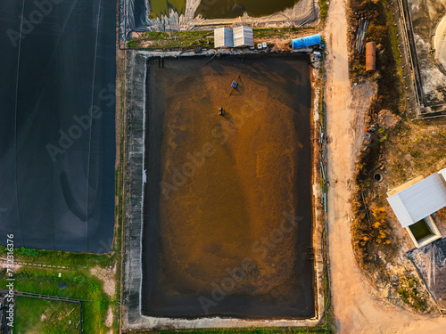 Aerial view wastewater treatment pond. Top view Bio-gas waste water treatment pond In industrial plants. Water pollution. Image for industrial background: sewage treatment, bioremediation, biogas.