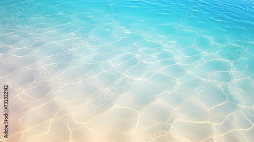 Sandy beach with light blue transparent water waves and sunlight, tranquil aerial beach scene