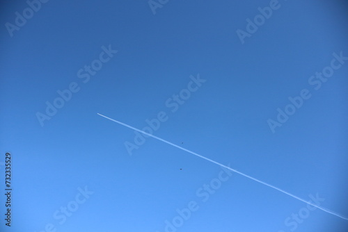 airplane and smoke in the blue sky