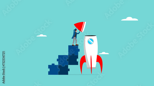 business startup progress, success steps in building a start-up business, journey to success in starting a business, businessman climbs the ladder of the puzzle and completes the rocket design photo