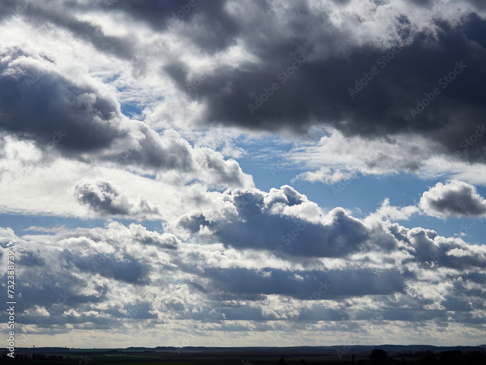 Cumulus clouds and field. Horizon and sky with field Cumulus clouds and field. Horizon and sky with field