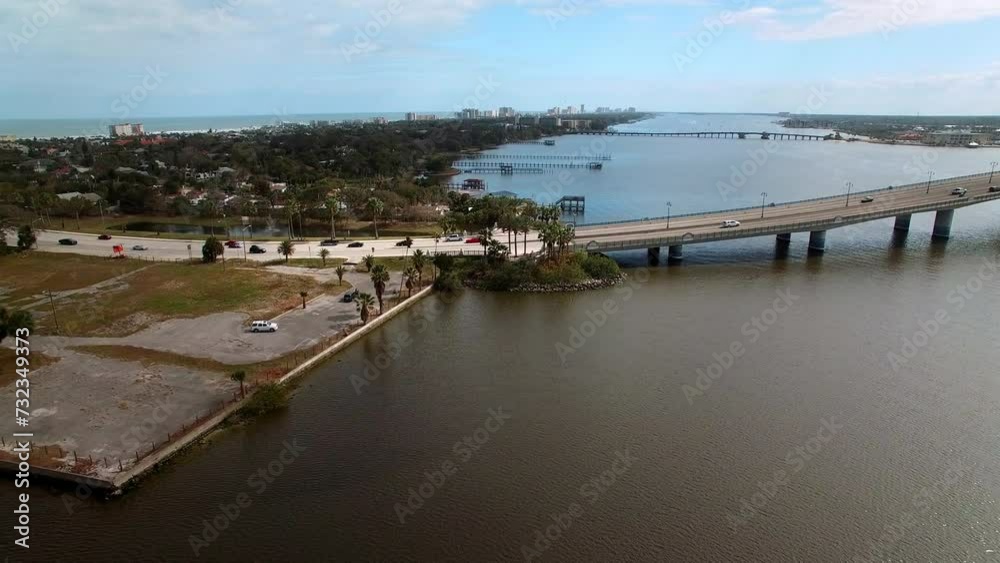 Aerial Shot Of Segmental Bridge And Belleair Causeway In City, Drone Flying Forward Over Halifax River On Sunny Day - Daytona Beach , Florida Aerial Shot Of Segmental Bridge And Belleair Causeway In City, Drone Flying Forward Over Halifax River On Sunny Day - Daytona Beach , Florida