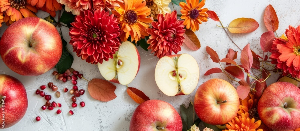 The table displays a mix of colorful elements including apples, flowers, leaves, and berries. It showcases a creative blend of nature's offerings such as fruits, flowering plants, and natural foods.