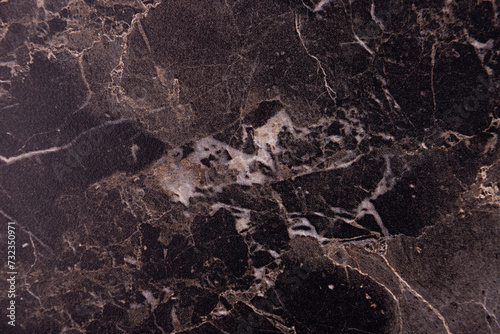 Marble texture. Black and brown stone background.