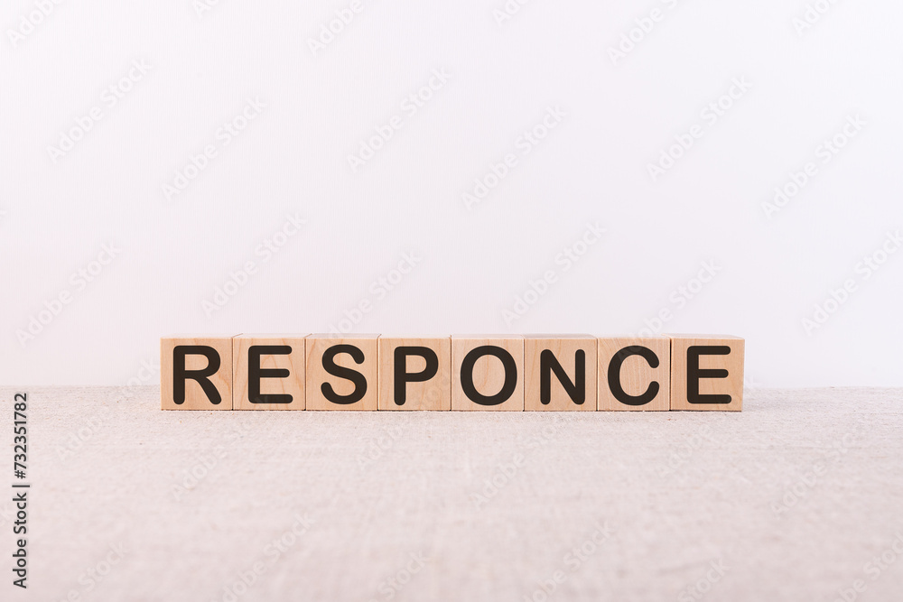 RESPONCE word concept written on wooden cubes on a light table and a light background RESPONCE word concept written on wooden cubes on a light table and a light background
