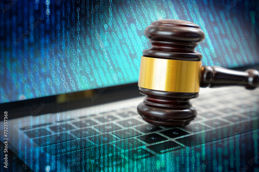 Laws regarding cyber crimes, Justice gavel on laptop computer keyboard ...