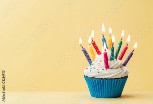 Birthday cupcake against a yellow background