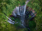 Aerial top view from above of Tumpak Sewu ,also known as Coban Sewu, 120m high waterfall in Malang regency, East Java, Indonesia